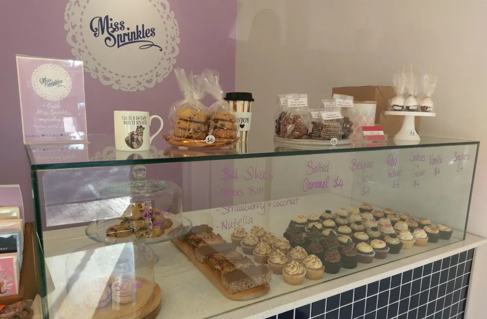 Inside the Miss Sprinkles shop: the cupcake cabinet and counter